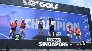 Brooks Koepka on the podium after his win at LIV Golf Singapore