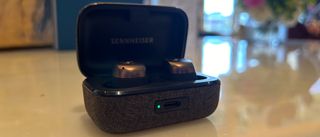 Sennheiser Momentum True Wireless 4 in black copper in their charging case