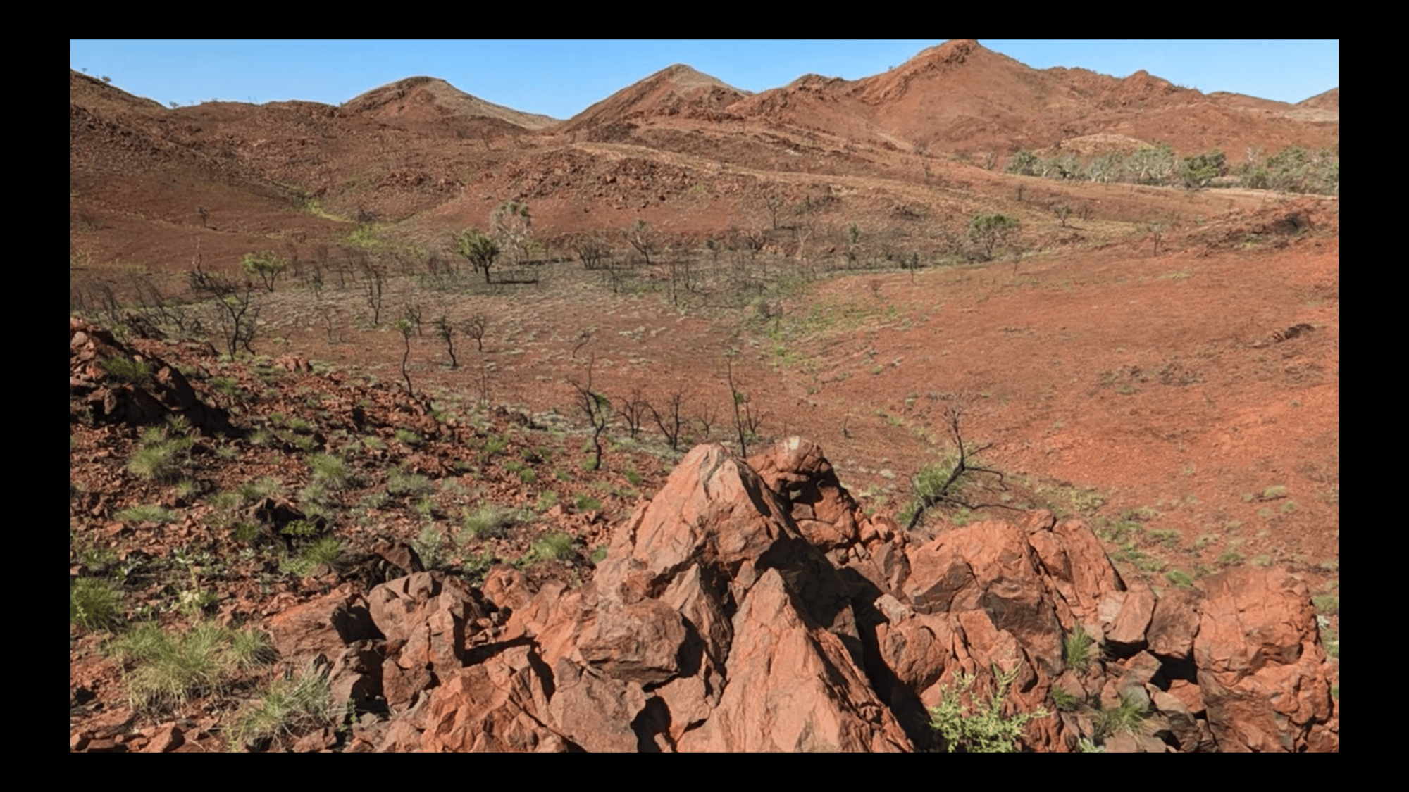 A view of a reddish rocky area.