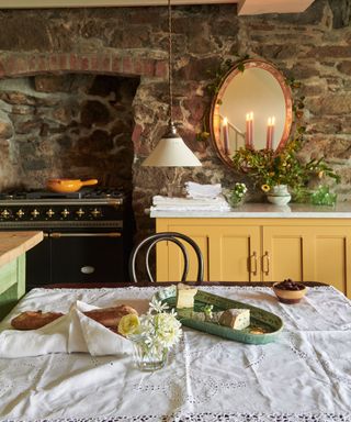 devol kitchens with exposed brick and lots of antique accessories