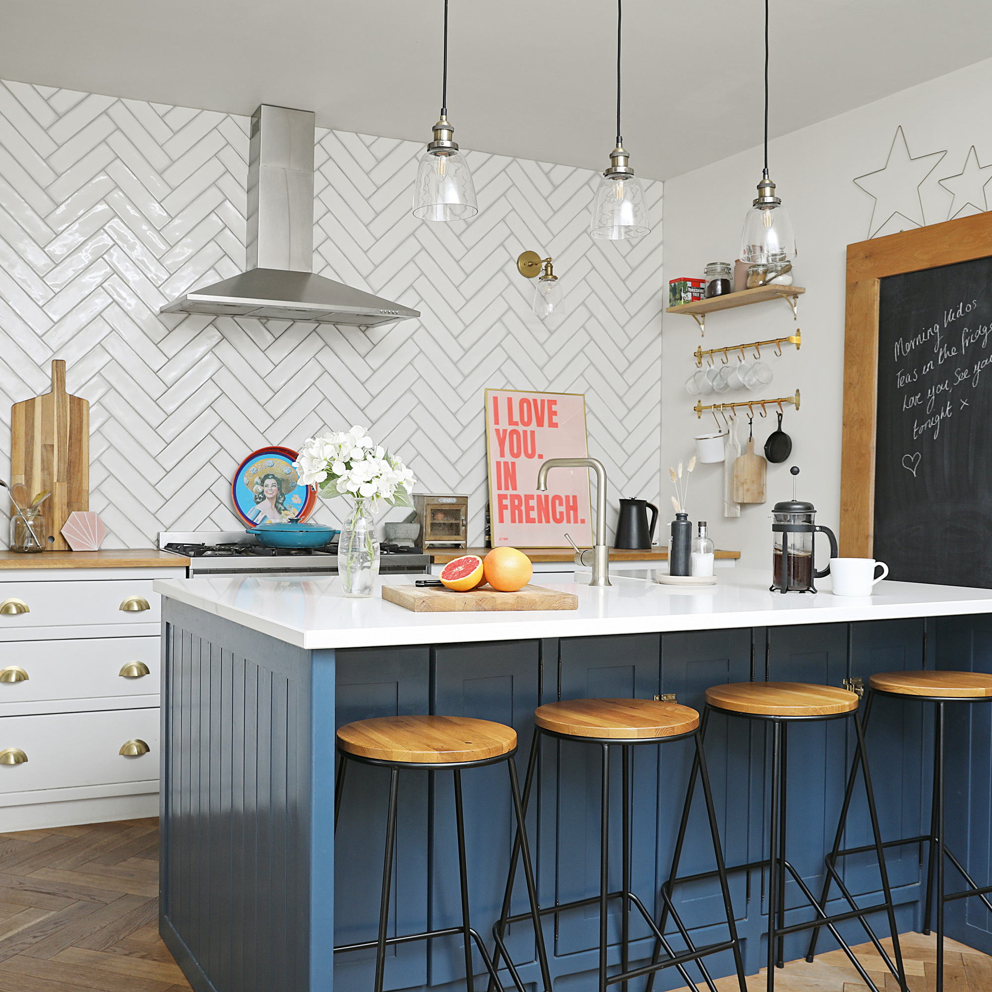 Victorian property revamp blue and white kitchen with kitchen island and white tiles