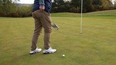 Golf glove dropped on golf ball