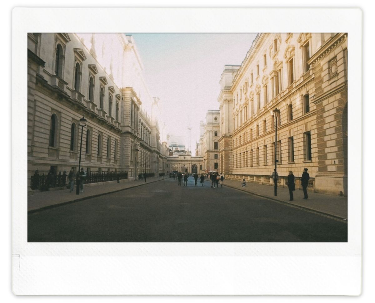 A street in central London flanked by large buildings