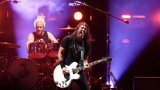 The Foo Fighters drummer and lead singer playing a gig