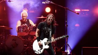 The Foo Fighters drummer and lead singer playing a gig