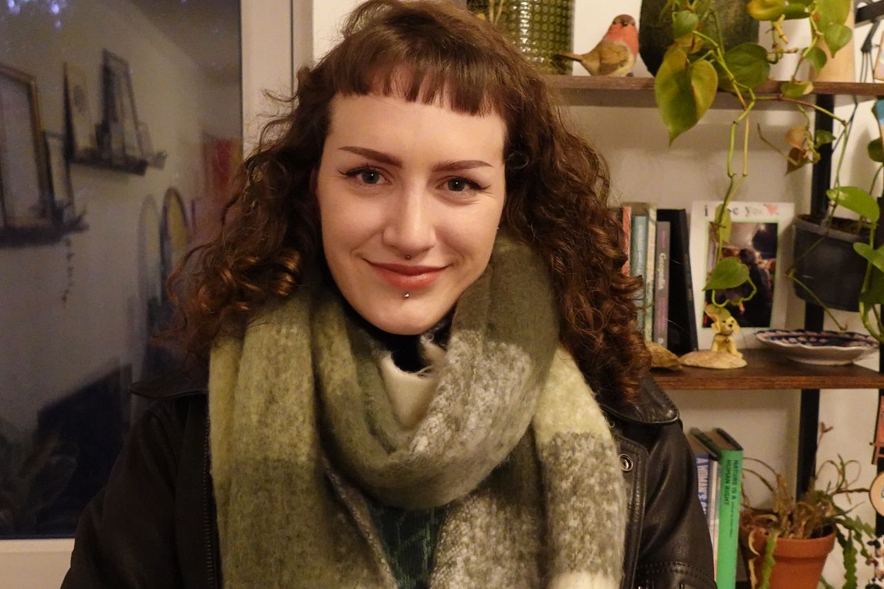 A photo of a woman smiling taken on a Sony ZV-1F vlogging camera