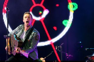 Coldplay are in the middle of a spat between the biggest names in digital music.