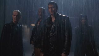 James Marsters, J. August Richards, David Boreanaz, and Amy Acker stand defiantly in the rain in the Angel series finale.