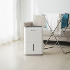 Honeywell 30L dehumidifier by washing in a living room