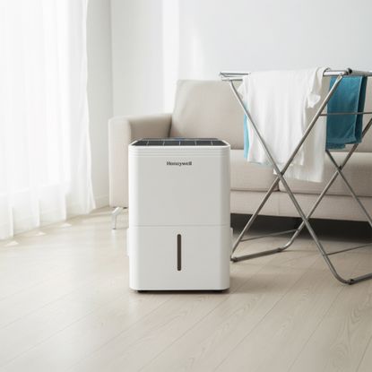 Honeywell 30L dehumidifier by washing in a living room