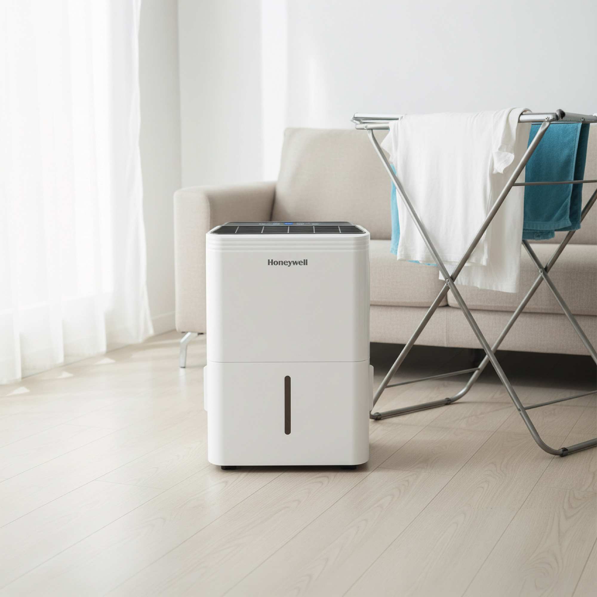Honeywell 30L dehumidifier by washing in a living room