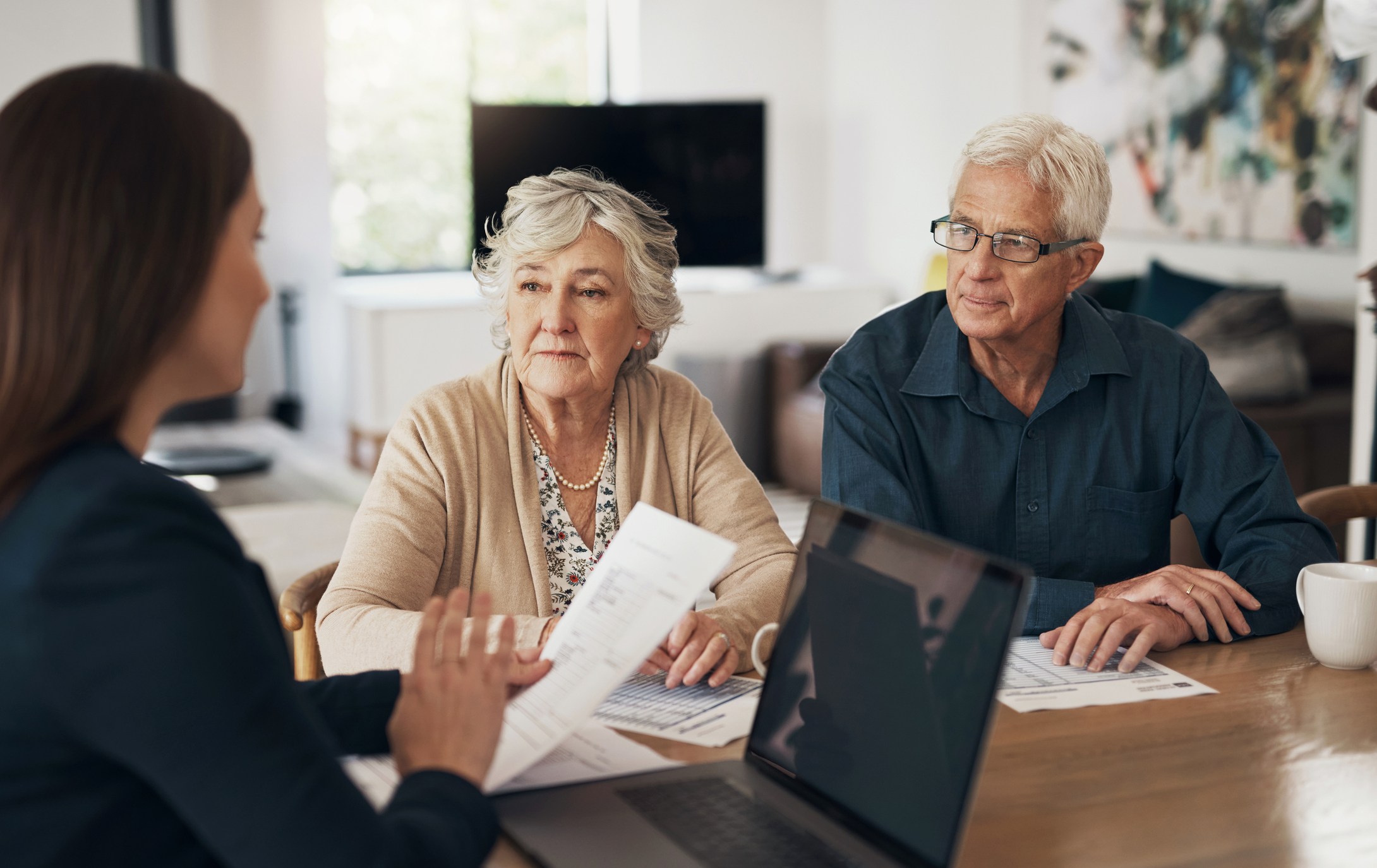 A couple discussing mortgage options with their lender