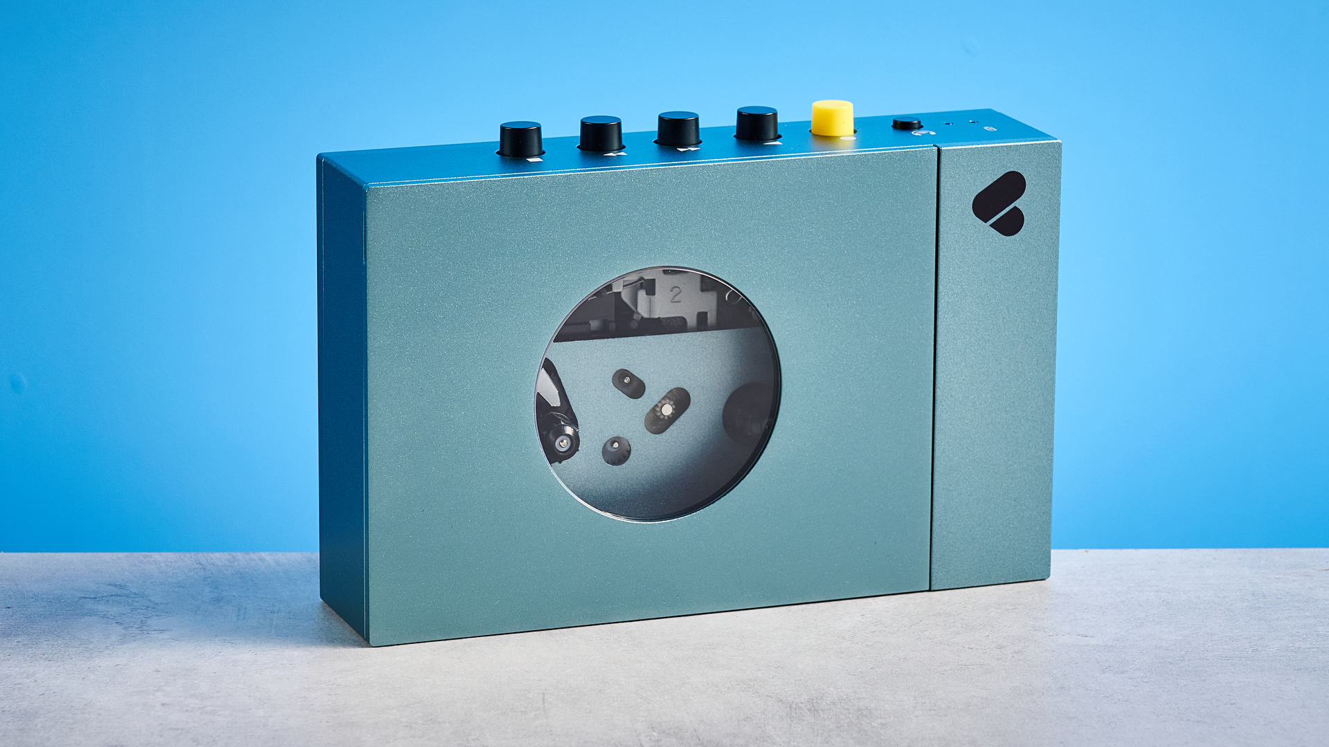 We Are Rewind Cassette Player in blue photographed in front of a blue background