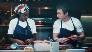 Sydney Adamu (Ayo Edebiri) and Carmy Berzatto (Jeremy Allen White) prepare food on The Bear.