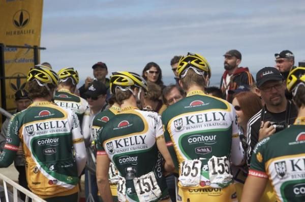 Kelly Benefit Strategies' riders sign in at the start.