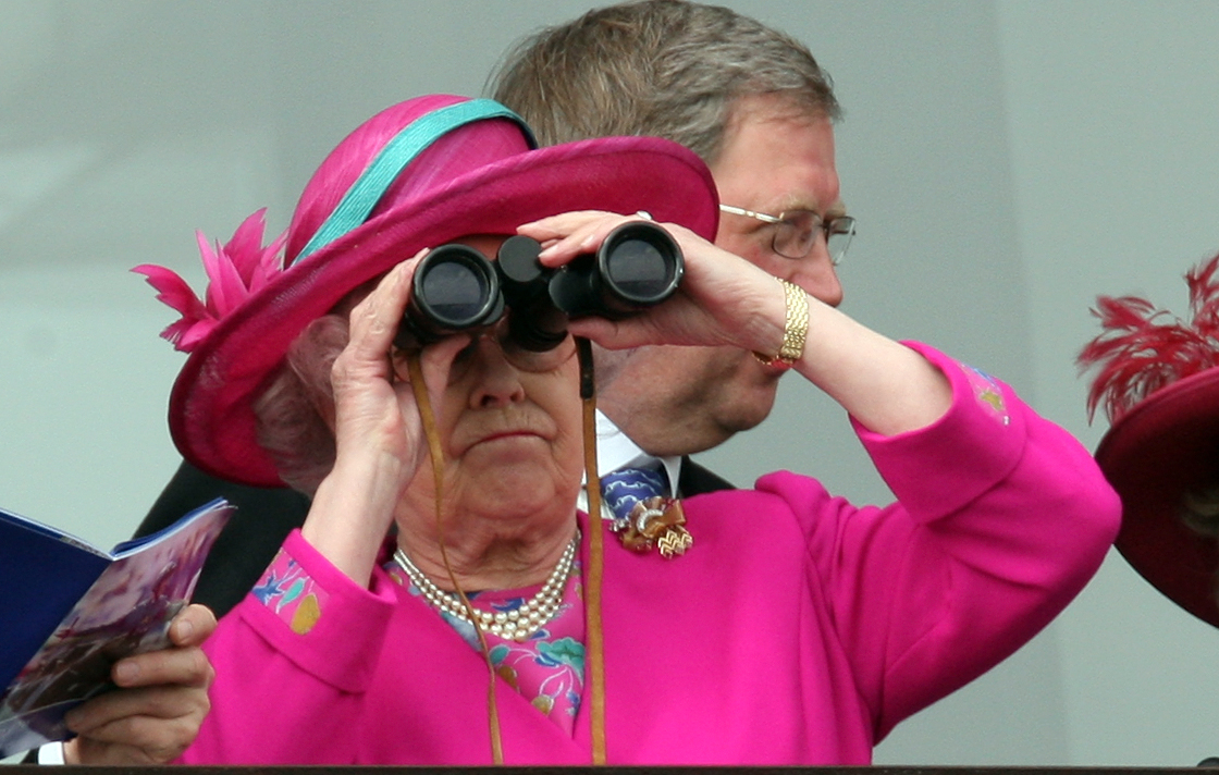 Queen Elizabeth wearing a pink hat and coat