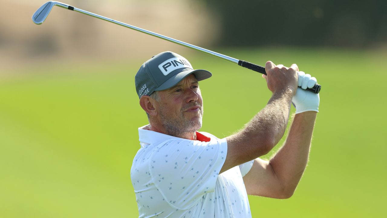 Lee Westwood hits an iron shot at the Saudi International