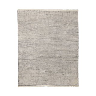 A neutral woven rug