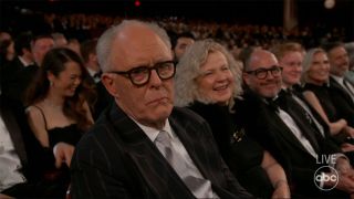 John Lithgow looking disappointed during the Oscars monologue