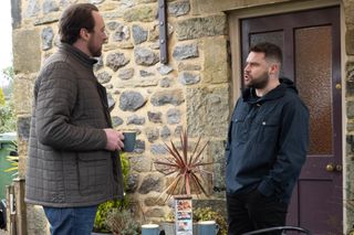 Liam with Aaron outside in Emmerdale