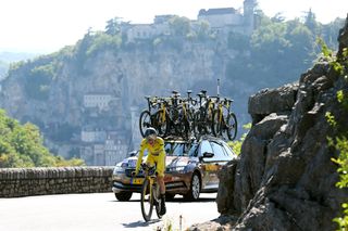 Jonas Vingegaard is trailed by a stacked team car on the final TT of the 2022 Tour de France