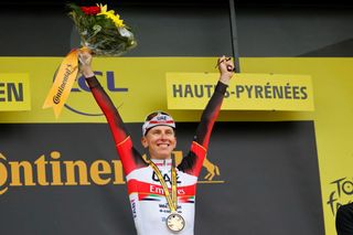 Stage winner Team UAE Emirates Tadej Pogacar of Slovenia celebrates on the podium after winning the 18th stage of the 108th edition of the Tour de France cycling race 129 km between Pau and Luz Ardiden on July 15 2021 Photo by Thomas SAMSON AFP Photo by THOMAS SAMSONAFP via Getty Images