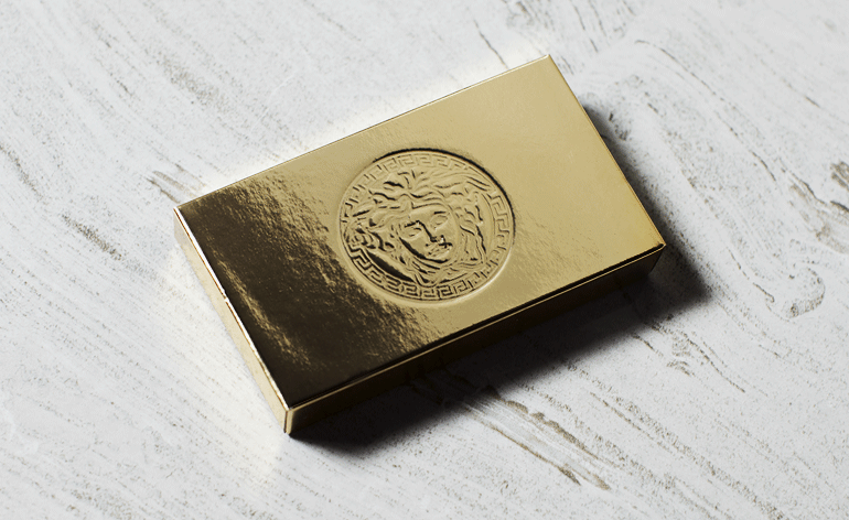 metallic box-in-a-box resembling a gold bar