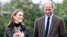 Catherine, Princess of Wales looks at Prince William as they walk in the orchards as they visit Long Meadow Cider on October 14, 2025