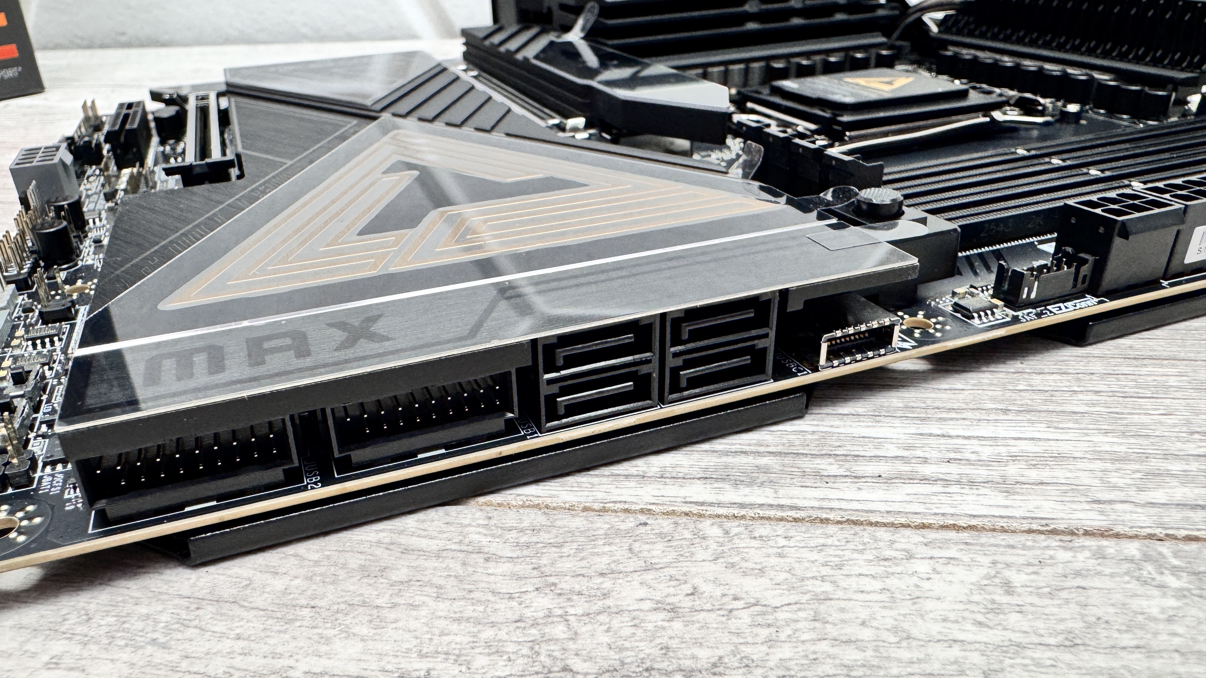 An MSI MEG X870E Ace Max motherboard on a desk.