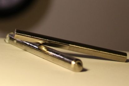 Rods of bulk metallic glasses, liquid metals