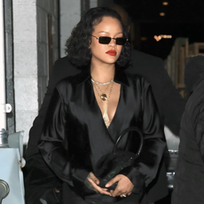 Rihanna wears zip-up leggings and a stain top