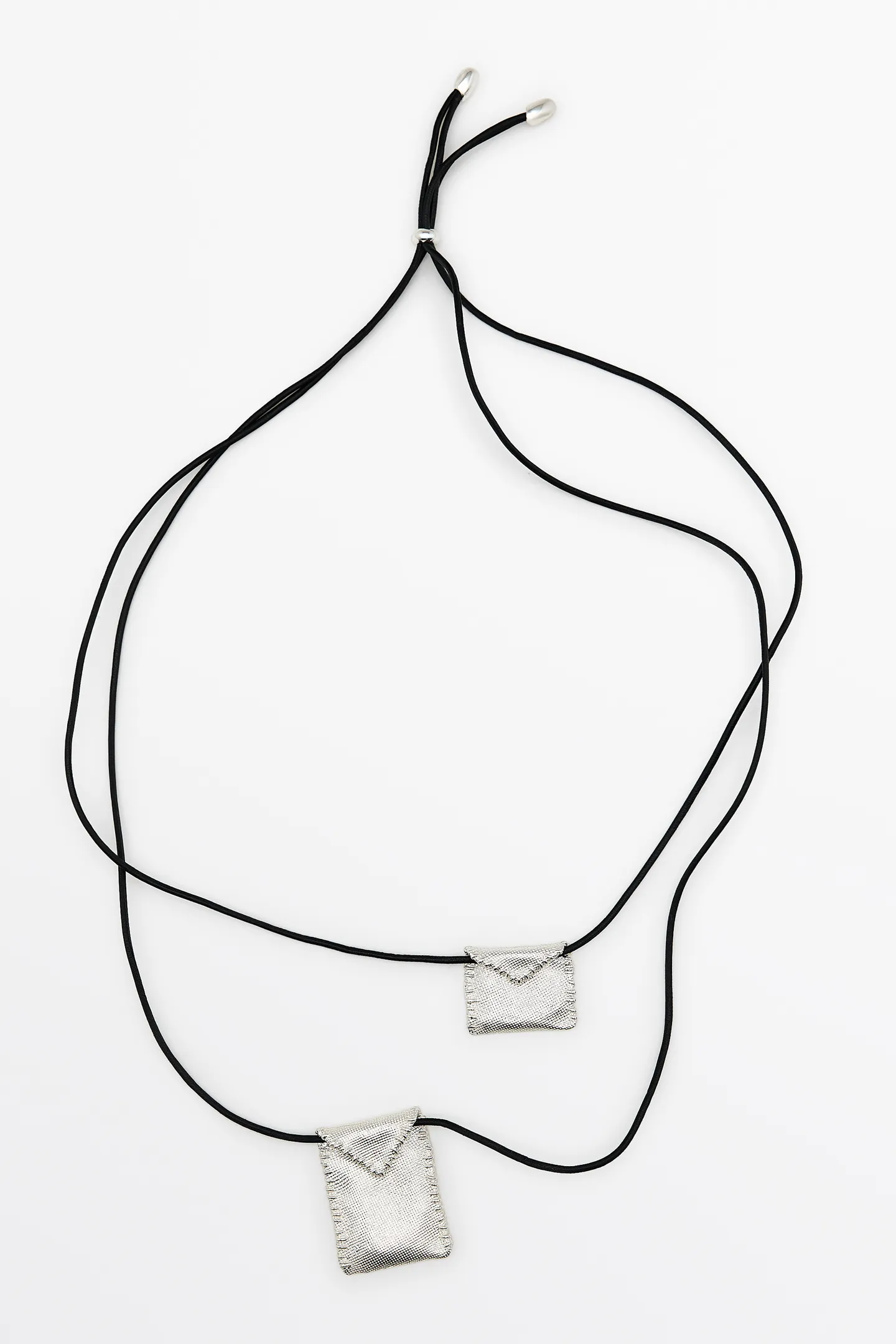 A cord necklace with silver envelope pendants from Massimo Dutti