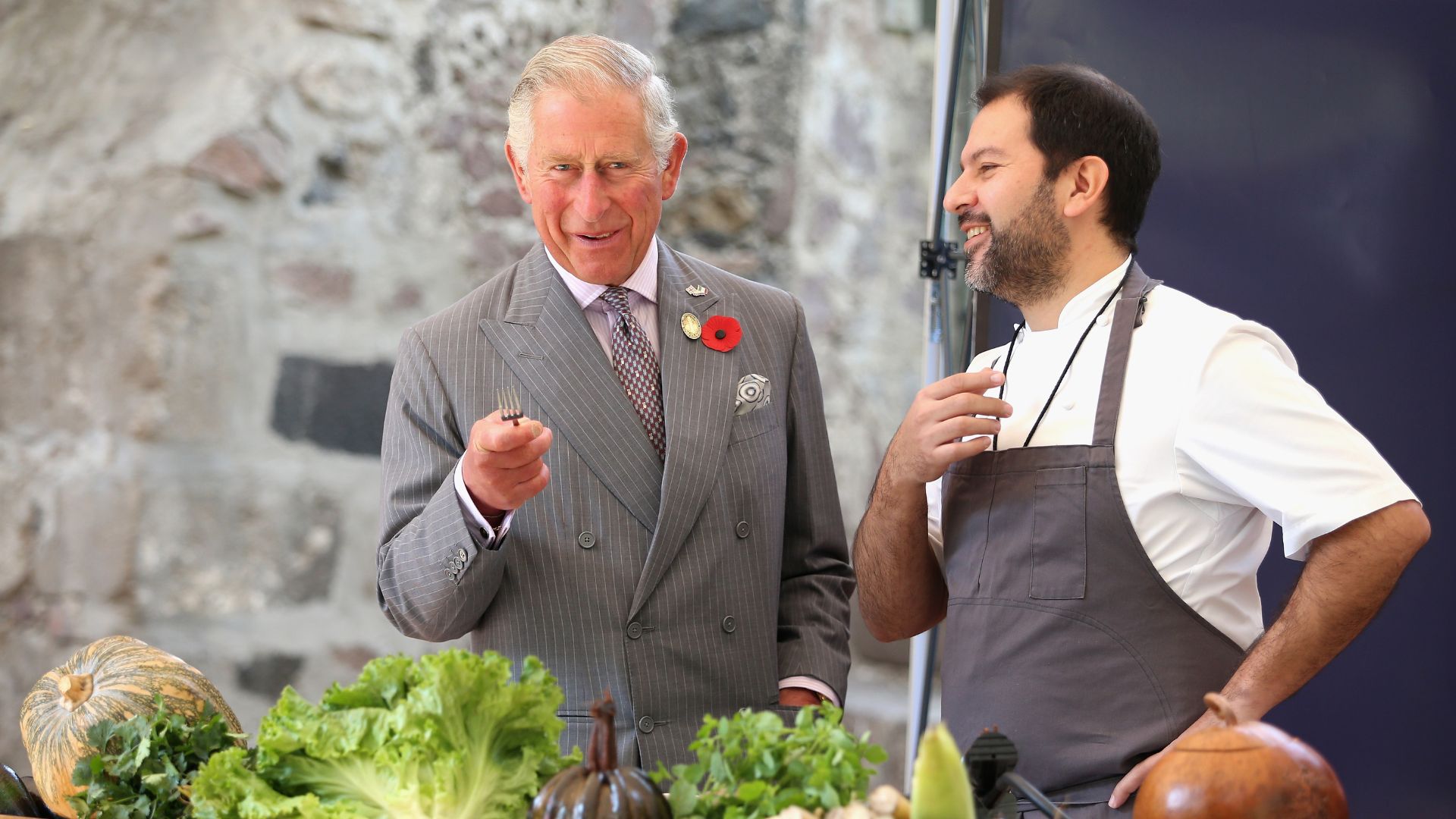 King Charles samples food with chef Enrique Olvera while on a royal tour of Colombia and Mexico in 2014