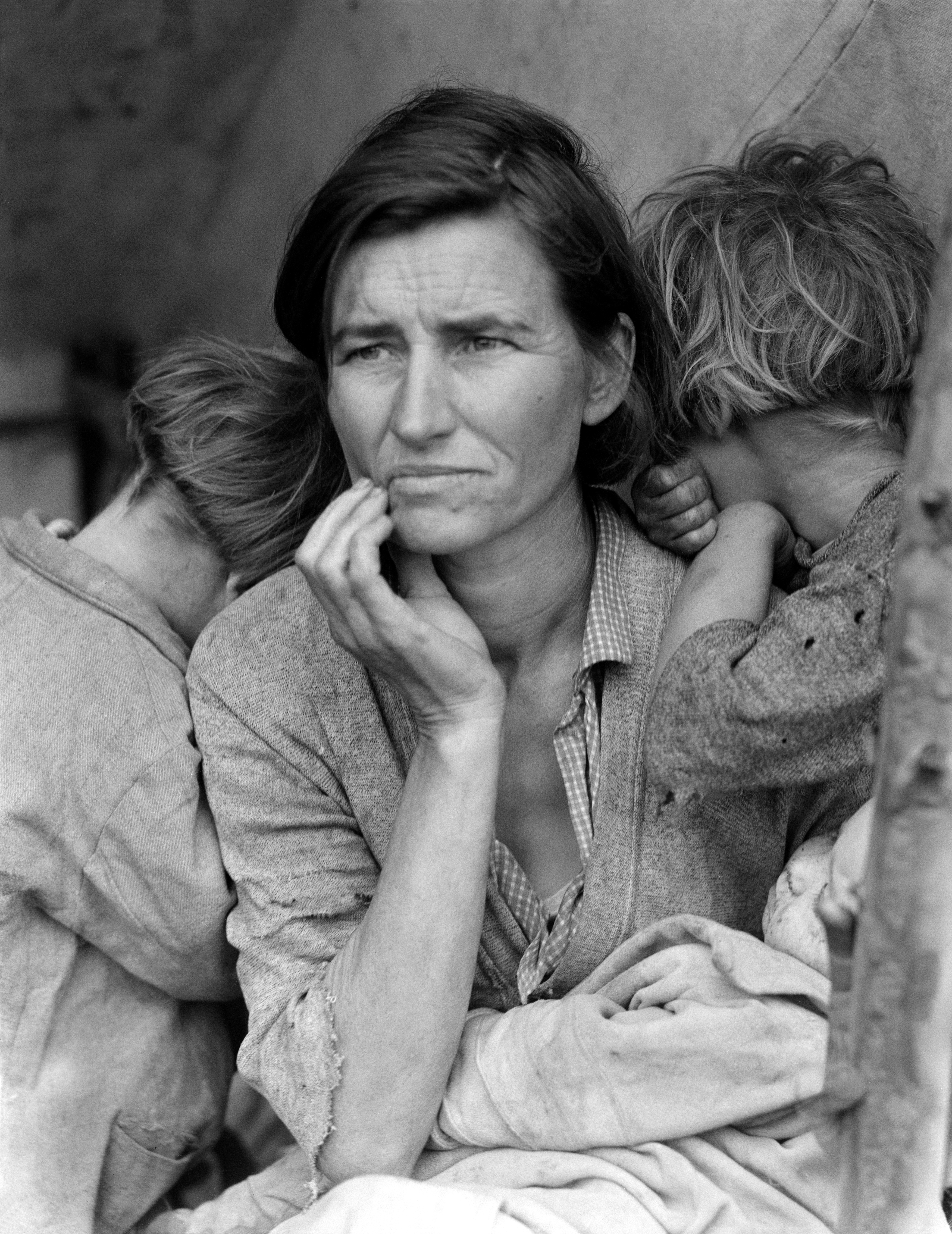 A sad woman with two children