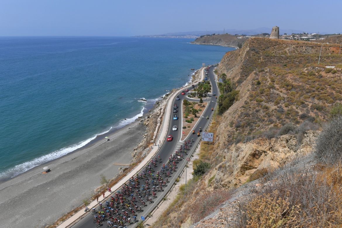 The peloton makes its way along the south coast