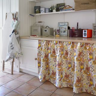 small utility room ideas with terracotta floor tiles curtains