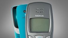 A Nokia 3210 phone on a grey background next to a remake from HMD