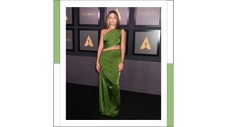 Margot Robbie wears a satin green Bottega gown as she at the Academys 13th Governors Awards held at the Fairmont Century Plaza on November 19, 2022 in Los Angeles, California.