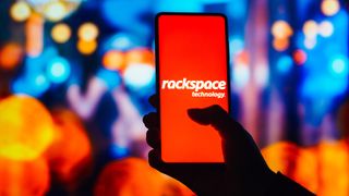 Rackspace logo displayed on a smartphone screen with branding blurred in background.