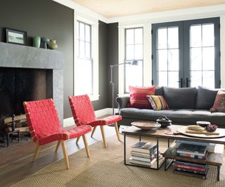 grey living room with red furniture by Benjamin Moore