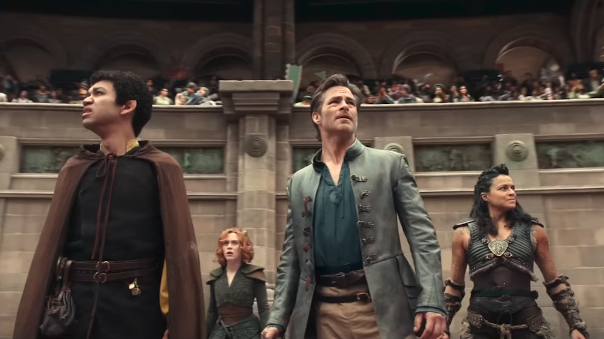 Justice Smith, Sophia Lillis, Chris Pine and Michelle Rodiguez looking around an arena in Dungeons &amp; Dragons: Honor Among Thieves