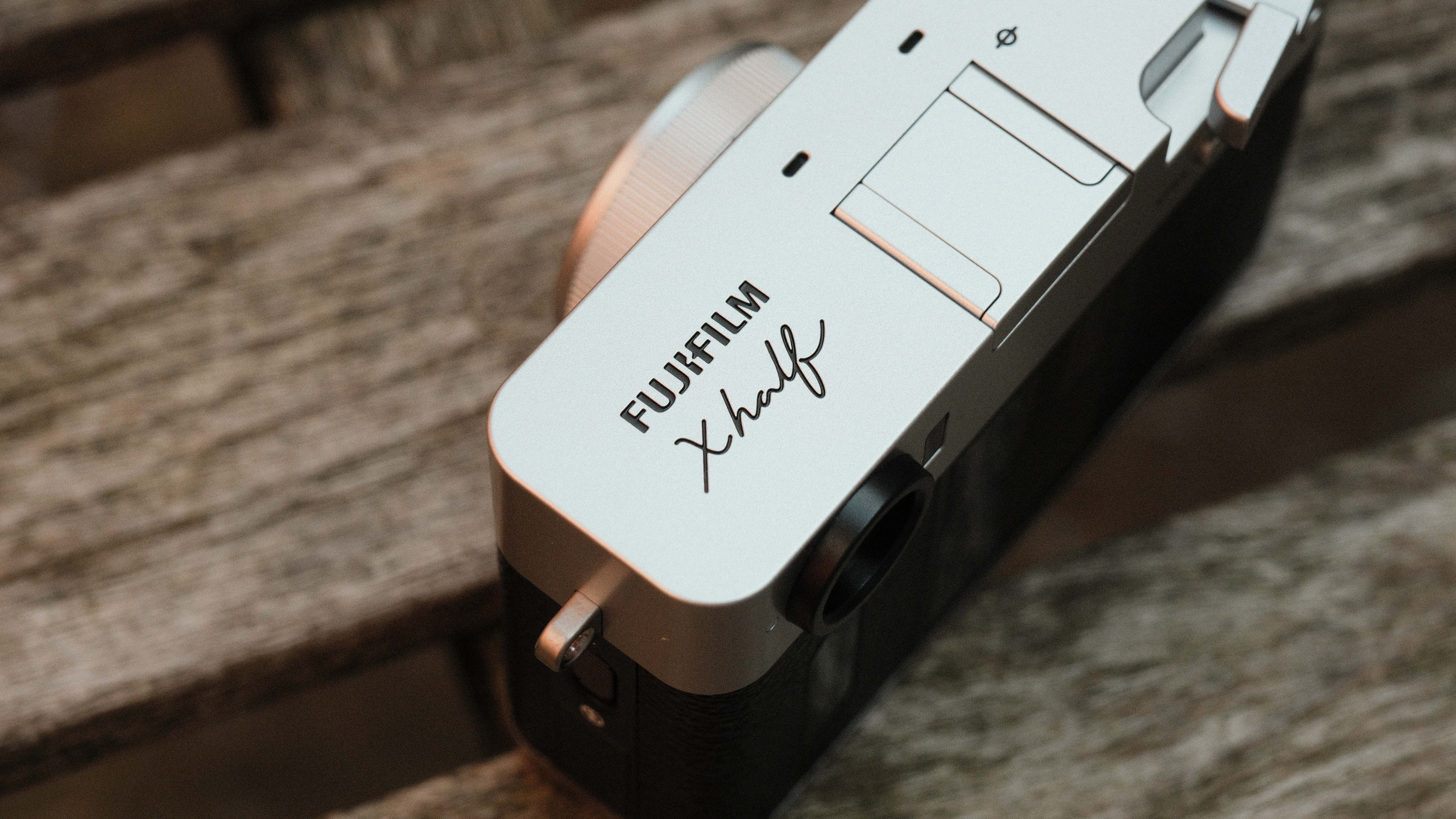 Fujifilm X Half camera on a wooden bench