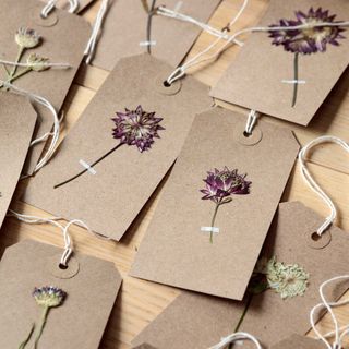 gift tage made using pressed flowers