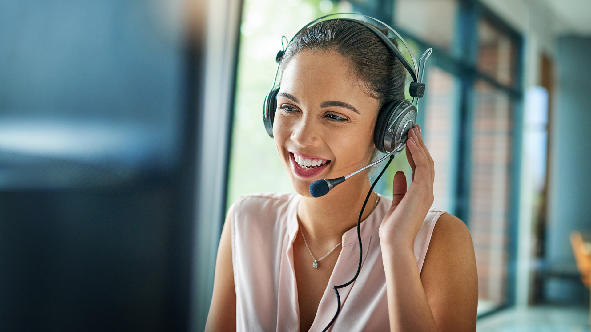 Shot of a young woman working in a call center