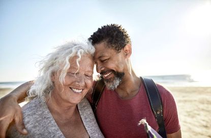 photo illustration of retiree couple on beach