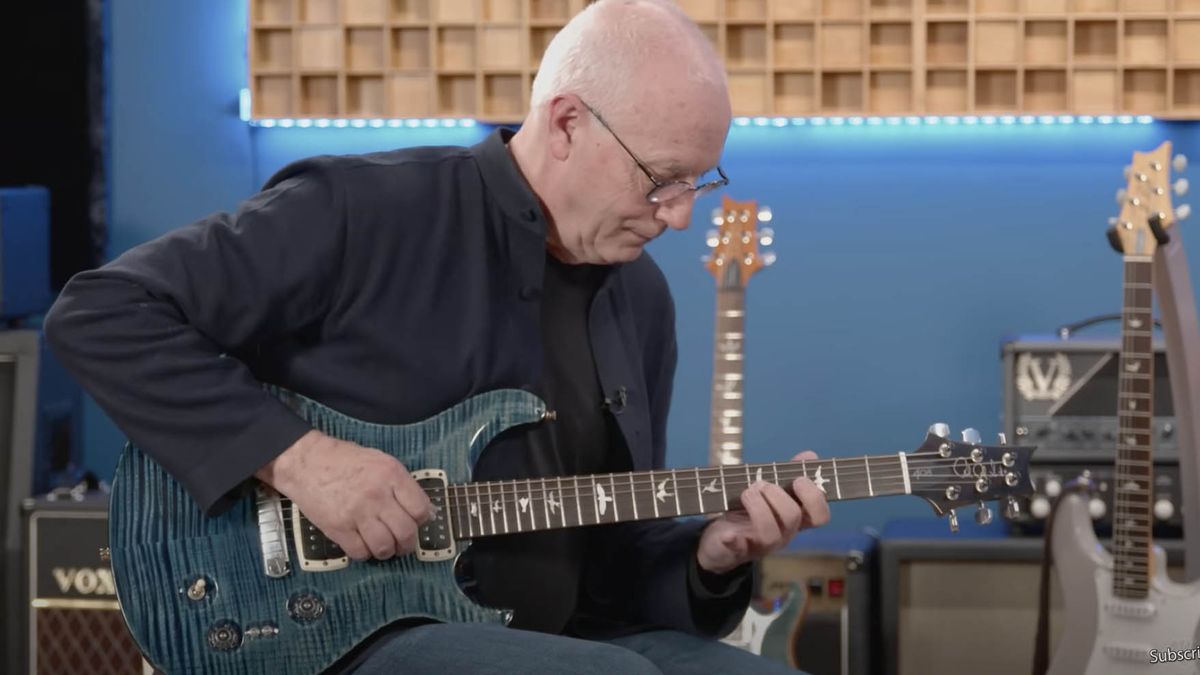 Paul Reed Smith playing a guitar