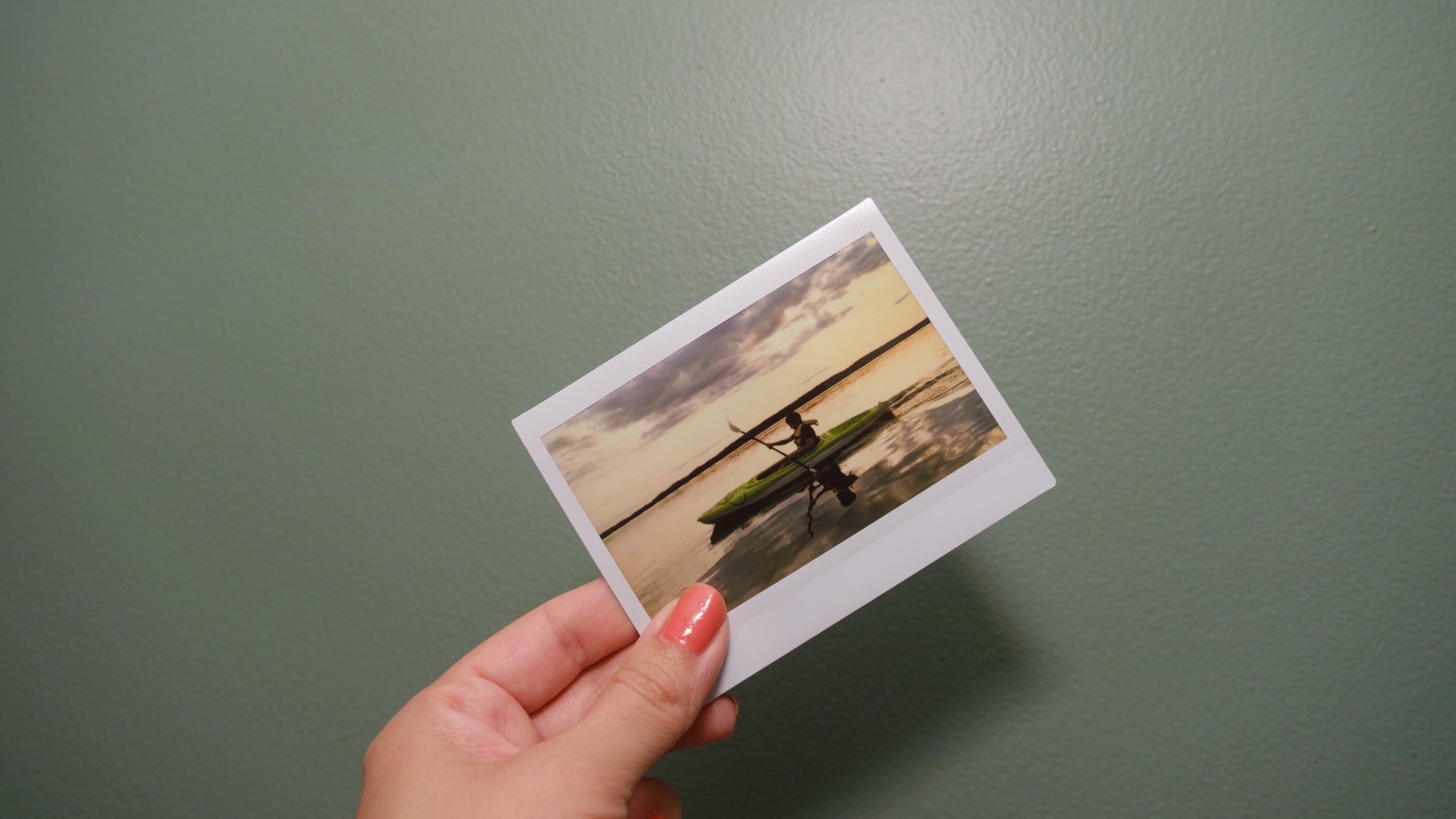 The Fujifilm Instax Link Wide 2 photo printer on a bookshelf