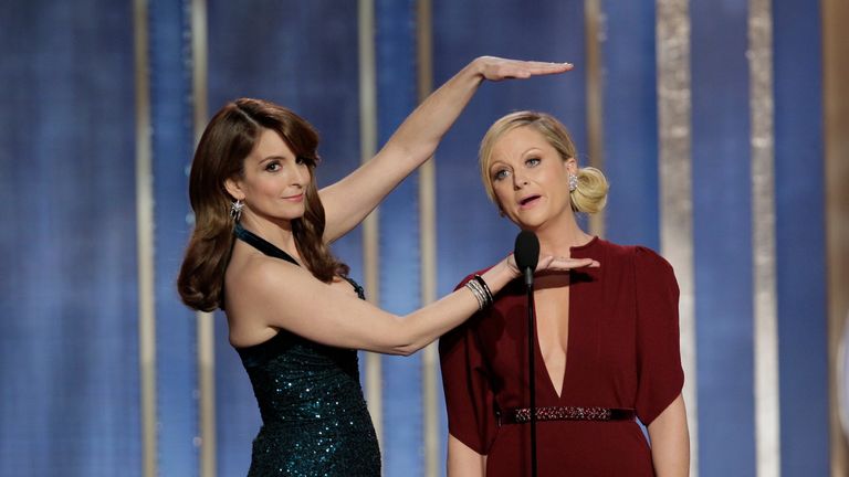 BEVERLY HILLS, CA - JANUARY 13: In this handout photo provided by NBCUniversal, L to R Tina Fey and Amy Poehler host the 70th Annual Golden Globe Awards at the Beverly Hilton Hotel International Ballroom on January 13, 2013 in Beverly Hills, California.