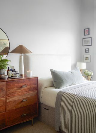 a bedroom with different size nightstands