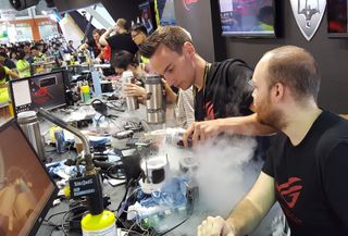 Roman Hartung pours liquid nitrogen into a CPU cooler in an overclocking contest at Computex 2017.